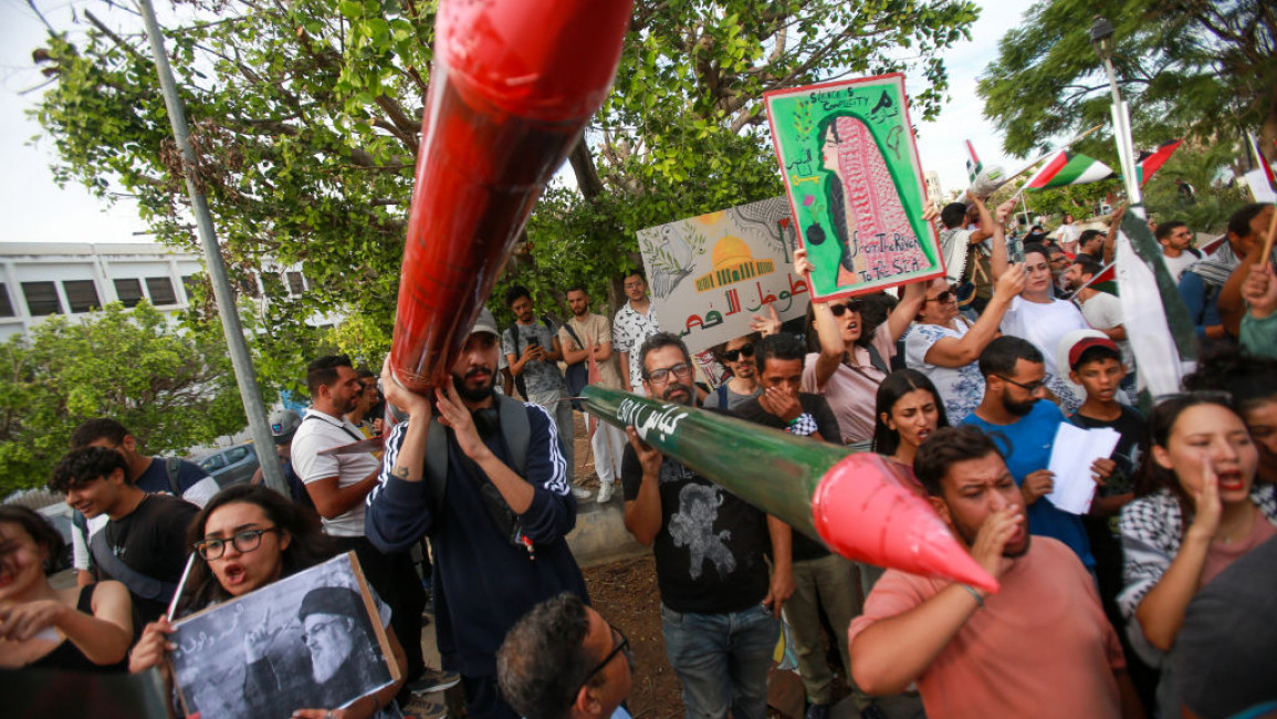 Protesters seen holding the national flags of Palestine and Lebanon at Bab Khadhra street during the demonstration. protestors gathered at Bab Khadhra, Tuni