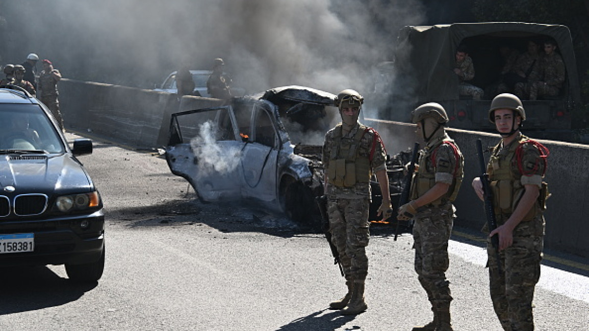 Lebanese forces take precautions by closing the area after an Israeli army attack on a vehicle in Aley, Mount Lebanon on October 24, 2024. (Photo by Houssam Shbaro/Anadolu via Getty Images)