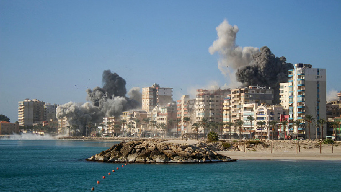 Smoke billows from the site of Israeli airstrikes on a neighbourhood in the southern Lebanese city of Tyre on October 28, 2024. (Photo by KAWNAT HAJU/AFP via Getty Images)