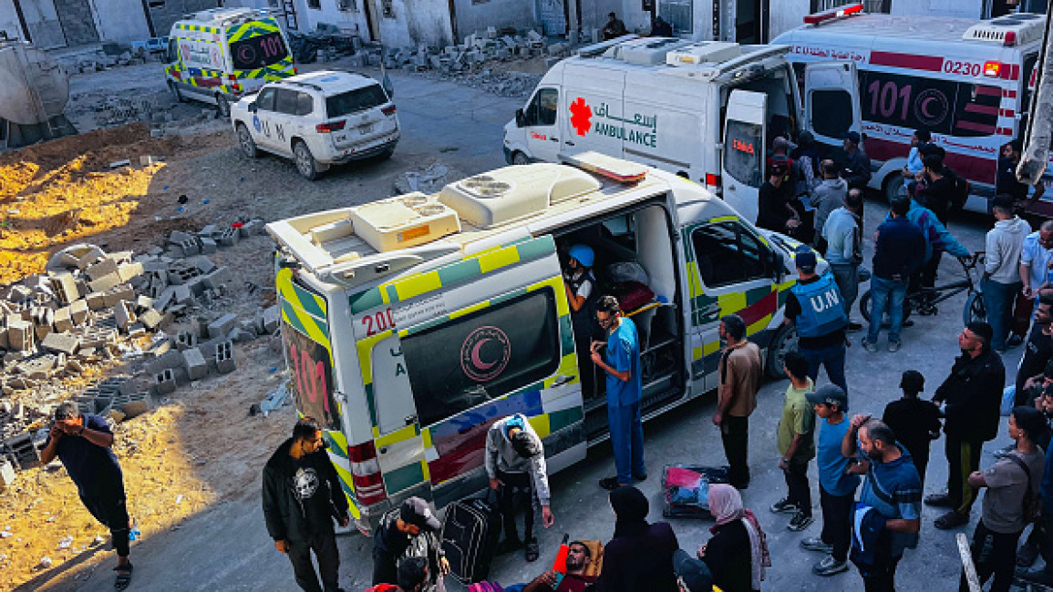 Medics evacuate injured people and cancer patients from the Kamal Adwan Hospital in Beit Lahia in the northern Gaza Strip on October 28, 2024, to al-Shifa hospital in Gaza City in a joint World Health Organisation and Palestinian Red Crescent initiative. 