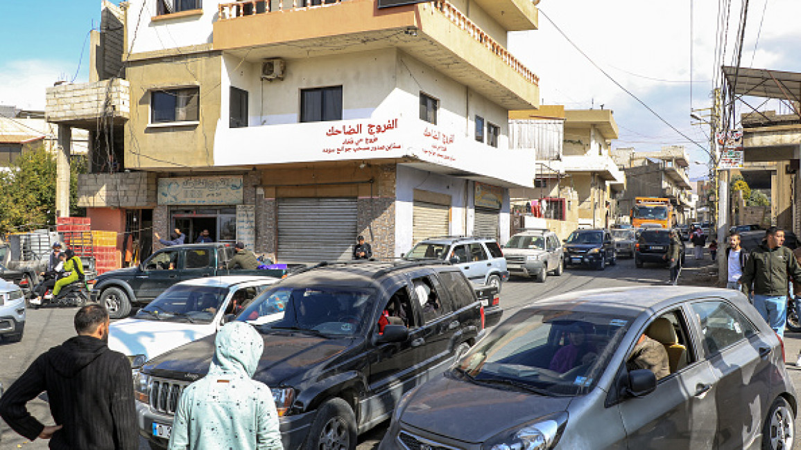 Vehicles condense along a road as residents of Lebanon's eastern city of Baalbek evacuate from the Bekaa Valley city on October 30, 2024, after a statement from the Israeli army spokesperson warning residents of incoming strikes. 