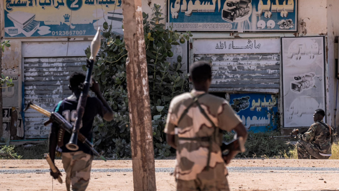 Sudanese army soldiers patrol an area in Khartoum North