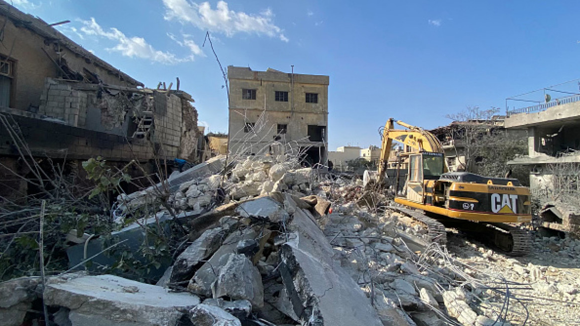 Rescue teams search for survivors and remove the rubble at the site of an Israeli airstrike that targeted Baalbek's al-Shiqan densely populated district in Lebanon's eastern Bekaa Valley on November 7, 2024.