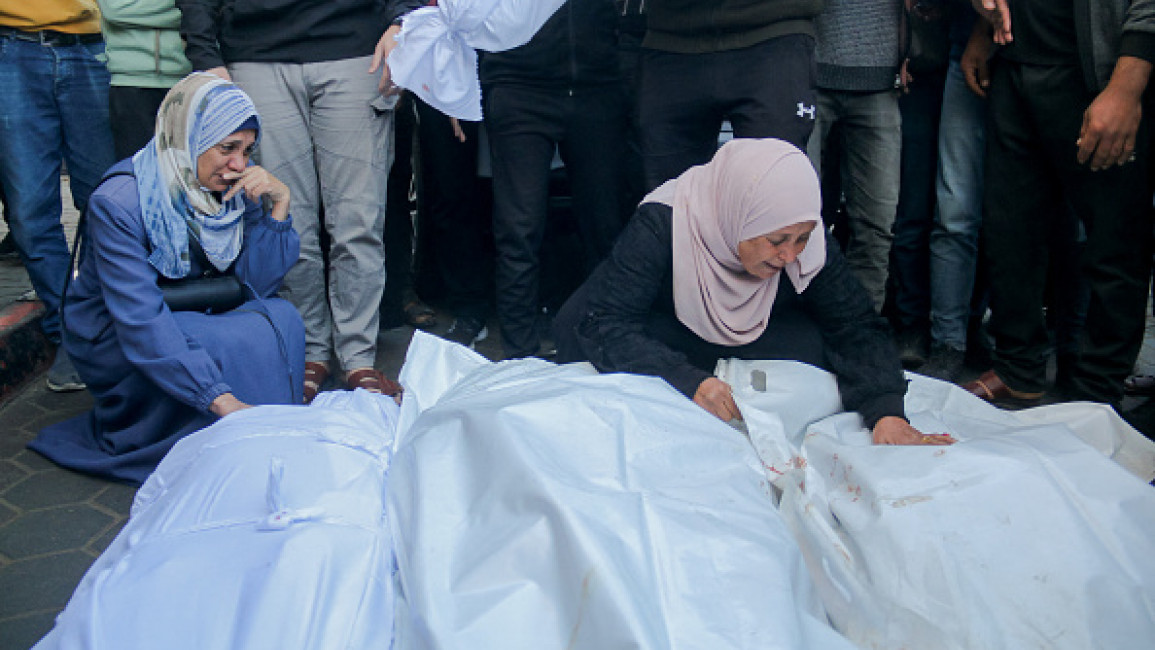 Palestinians mourn loved ones [Getty]