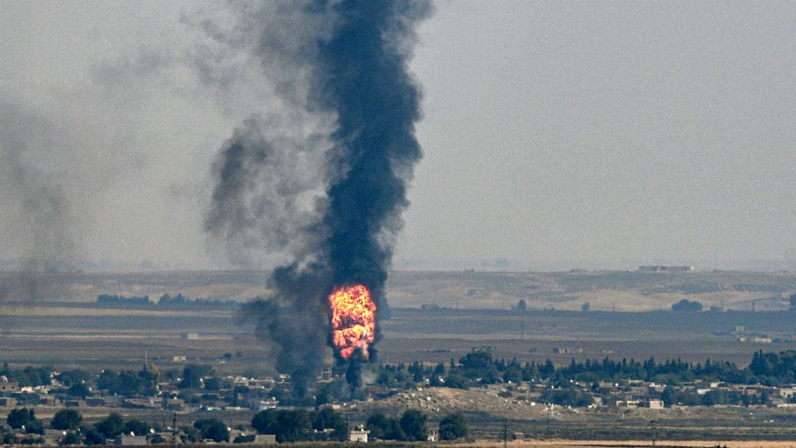 Smoke rising from the town of Ras al-Ain -Getty