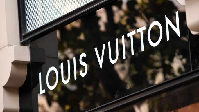 Louis Vuitton sign on front of the store, Stock Video